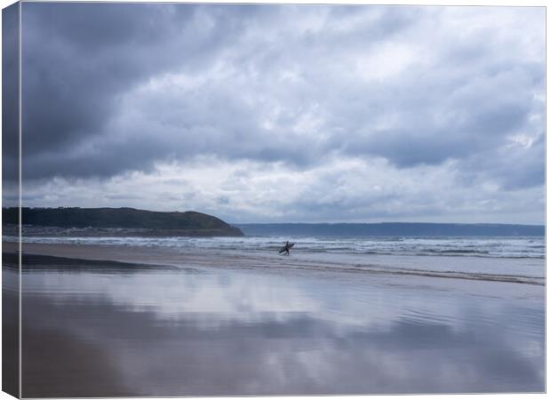 Surfer at Westward Ho Canvas Print by Tony Twyman