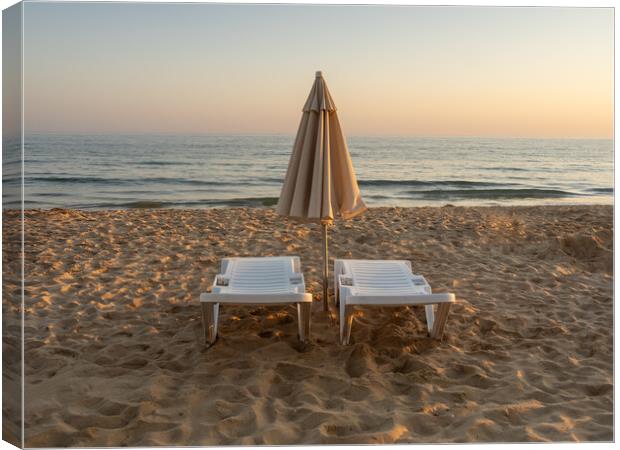 Sun beds on Falesia Beach in Portugal Canvas Print by Tony Twyman
