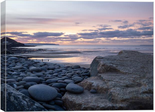 Sunset through the rocks Canvas Print by Tony Twyman