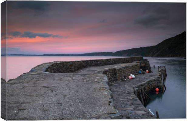 sunset at the harbour wall of Clovelly in Devon Canvas Print by Tony Twyman