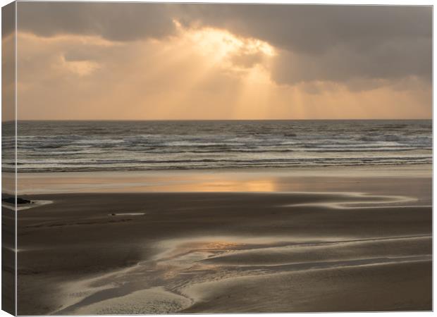 Ray of sunlight through the clouds at Westward Ho! Canvas Print by Tony Twyman