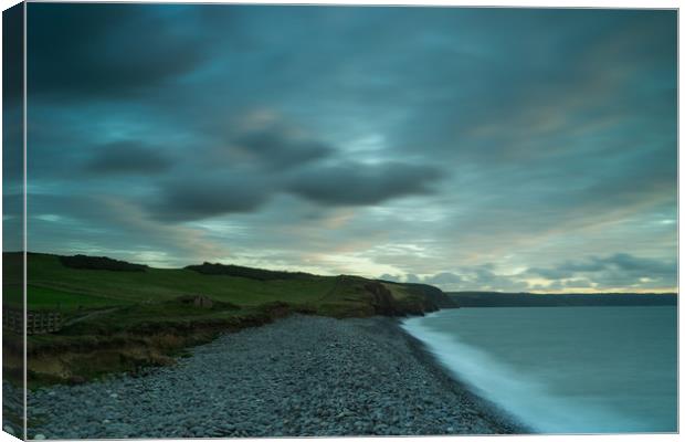 Moody sky at High tide on South West coast path  Canvas Print by Tony Twyman