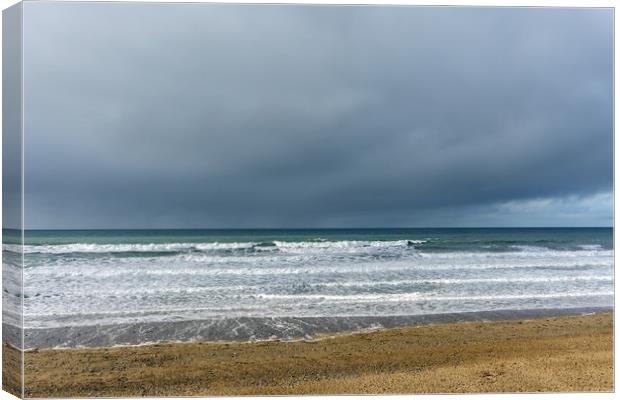 Moody clouds at Widemouth Bay near Bude Canvas Print by Tony Twyman