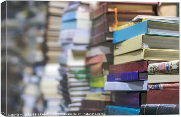 Close-up of stacks of old books, selective focus. Canvas Print by RUBEN RAMOS