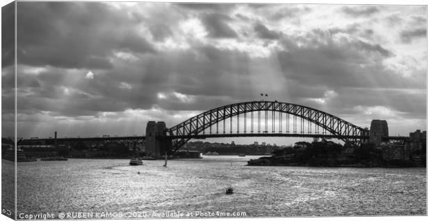 The Sydney Harbour Bridge under clouds.  Canvas Print by RUBEN RAMOS