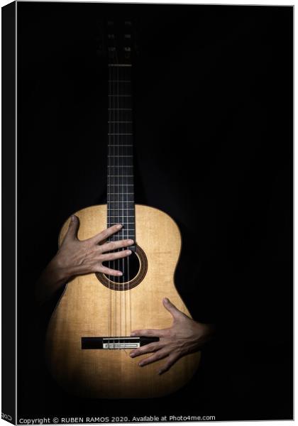 Female hands on guitar. Canvas Print by RUBEN RAMOS