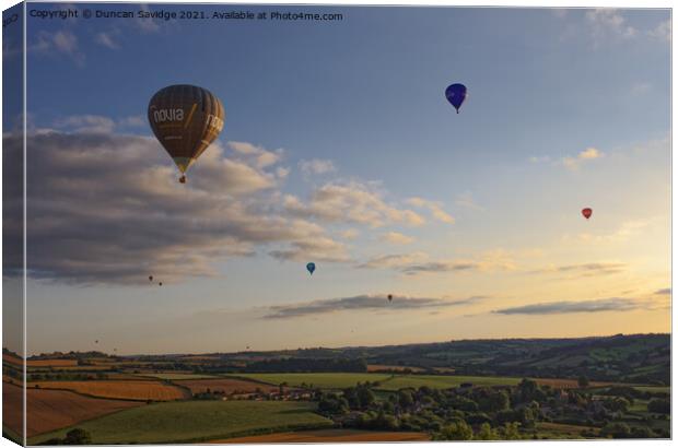 Hot air balloons over Englishcombe village  Canvas Print by Duncan Savidge