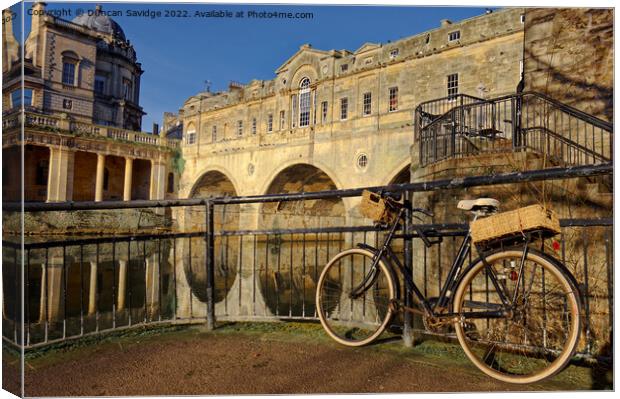 The old Bicycle and Pulteney Bridge Canvas Print by Duncan Savidge