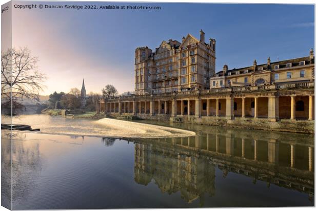 Empire hotel in Bath reflected in the River Avon early morning Canvas Print by Duncan Savidge