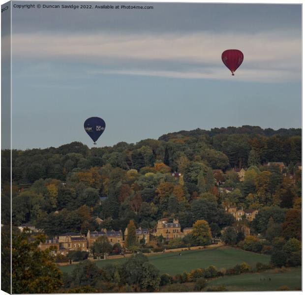 Two hot air balloons coming into land at Sham Castle in Bath Canvas Print by Duncan Savidge