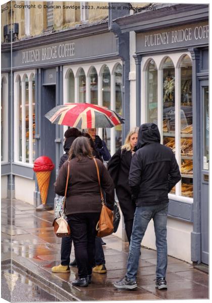 Pulteney Bridge coffee shop in the rain Canvas Print by Duncan Savidge