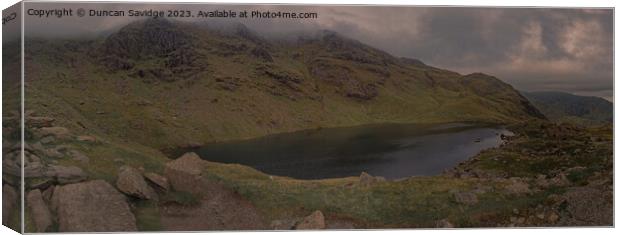 Moody panoramic of Low Water, Coniston Canvas Print by Duncan Savidge