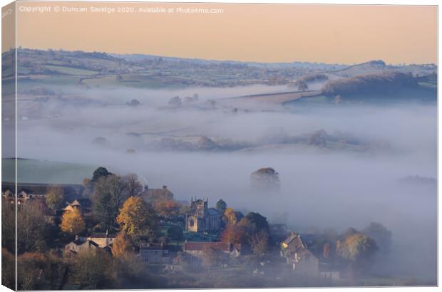 Autumnal mist of Englishcombe Village near Bath Canvas Print by Duncan Savidge