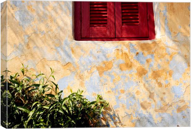 Red shutters, Athens. Canvas Print by John Robertson