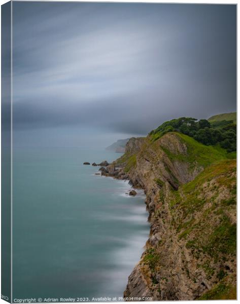 Jurassic Coast looking West from Lulworth Cove Canvas Print by Adrian Rowley