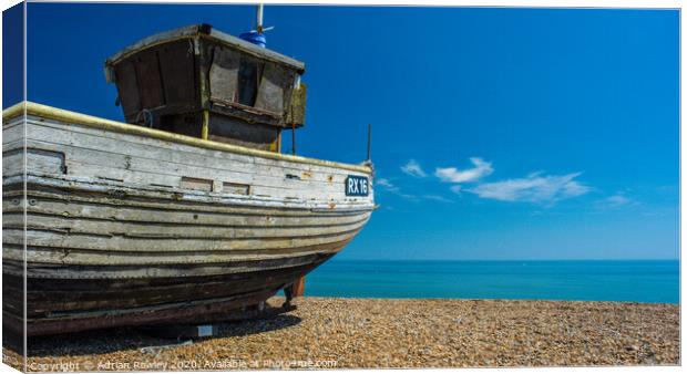 Fishing boat at Hastings beach Canvas Print by Adrian Rowley