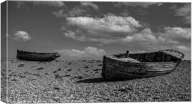 Abandoned fishing boats at Dungeness in Kent. Canvas Print by Adrian Rowley