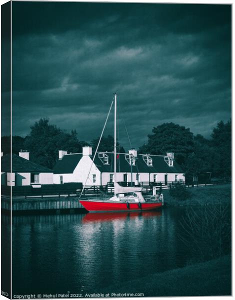 Red sailboat moored in water near traditional style homes Canvas Print by Mehul Patel