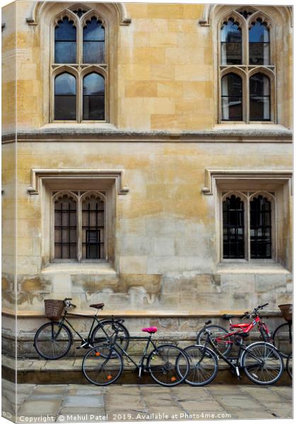 Bicycles parked along the pavement in Cambridge Canvas Print by Mehul Patel