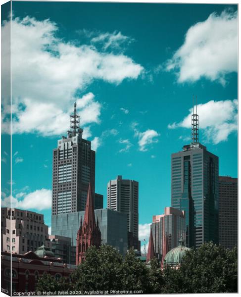 Skyline of skyscrapers against turquoise sky - Melbourne, Australia Canvas Print by Mehul Patel