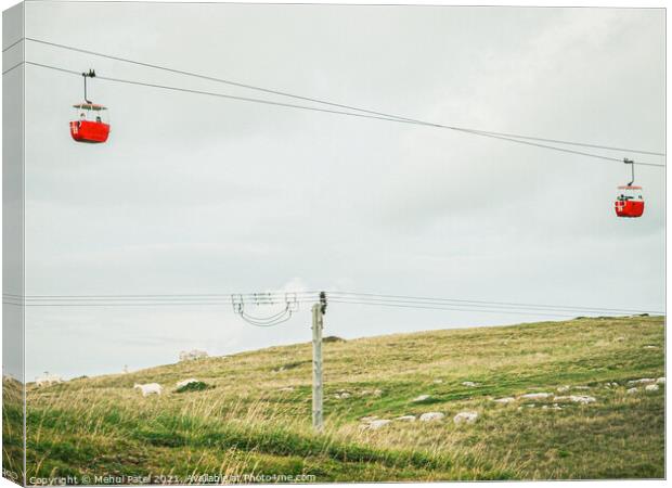 Red cable cars and goats on hill at the Great Orme Country Park above Llandudno, North Wales, UK Canvas Print by Mehul Patel
