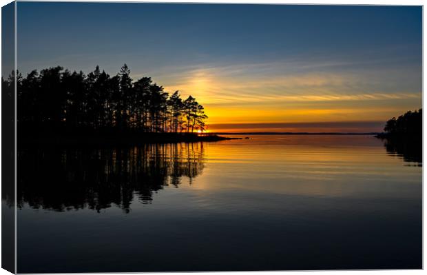 orange sunset over a calm lake in Sweden Canvas Print by Jonas Rönnbro