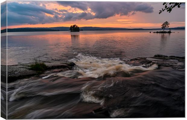 streaming water sunset over lake Canvas Print by Jonas Rönnbro