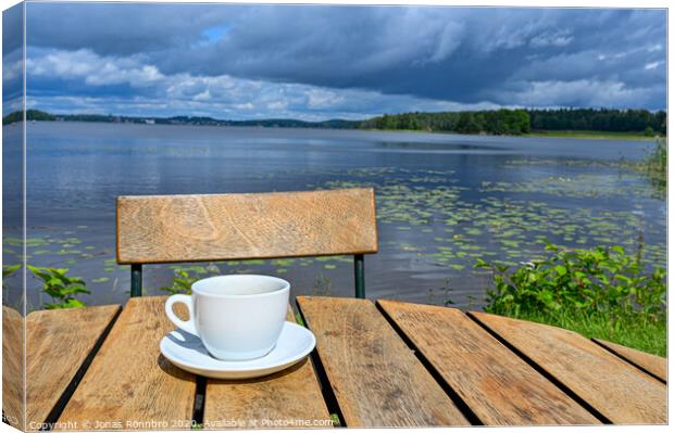 coffee cup on wooden table near lake Canvas Print by Jonas Rönnbro