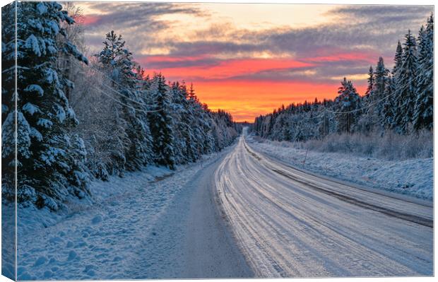 winter road in Varmland Sweden and orange sunrise Canvas Print by Jonas Rönnbro