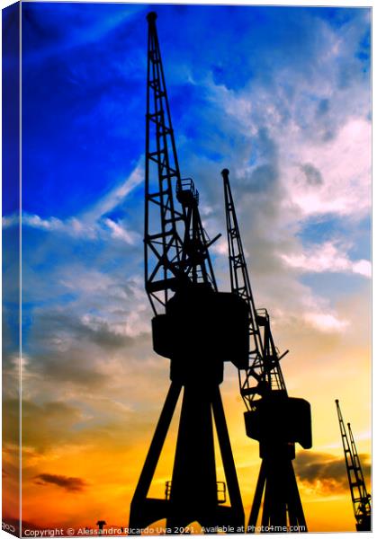 Port Cranes at London docklands - orange sunset Canvas Print by Alessandro Ricardo Uva