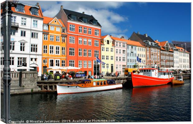 famous Nyhavn place in Copenhagen, Denmark Canvas Print by M. J. Photography