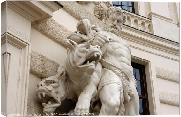 Antique scene of fight between man and mythical creatures on The Hofburg palace in Vienna Canvas Print by M. J. Photography