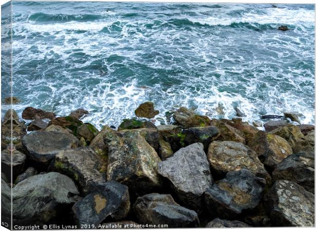 Waves on the Rocks Canvas Print by Ellis Lynas