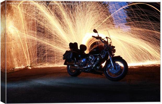 Sports Bike with Sparks Behind Canvas Print by Peter Barrett