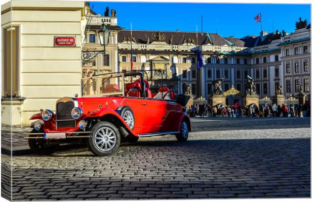 Vintage red car and the Prague Castle Canvas Print by Jelena Maksimova
