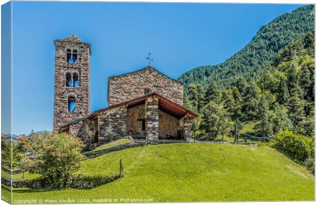 Hilltop and stone church facade in the Pyrenees. Andorra Europe Canvas Print by Mario Koufios