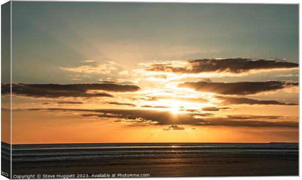 Sunset with  Rays bracking through the cloud at Pembrey Beach Wales Canvas Print by Steve Huggett