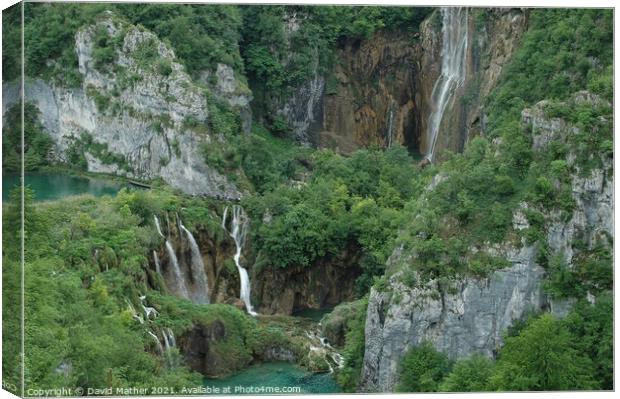 Waterfalls at Plitvicka Lakes, Croatia dwarf the visitors Canvas Print by David Mather