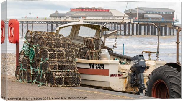 Crab pots and fishing boat on Cromer beach Canvas Print by Chris Yaxley