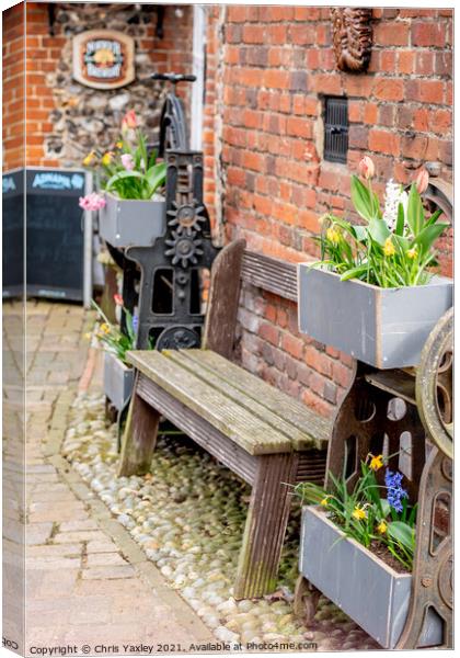 Wooden bench outside the Adam & Eve Pub, Norwich Canvas Print by Chris Yaxley