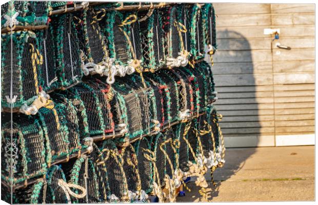 Crab pots and lobster traps on Well-Next-The-Sea quay Canvas Print by Chris Yaxley