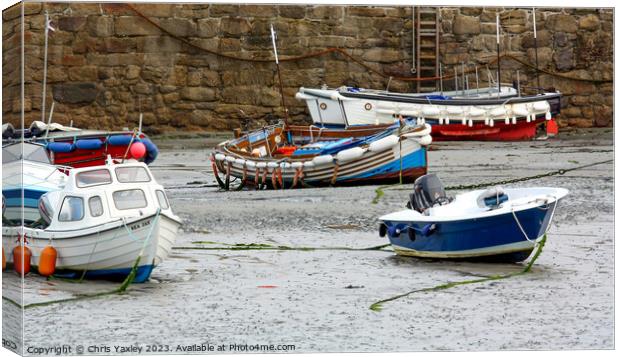 Fishing boats in Padstow Harbour at low tide Canvas Print by Chris Yaxley