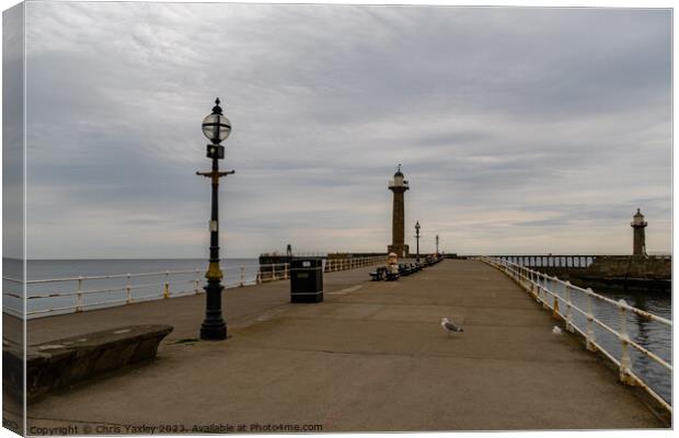 The east pier in the seaside town of Whitby on the Canvas Print by Chris Yaxley