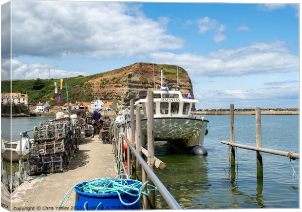 Fishing boat in Staithes harbour Canvas Print by Chris Yaxley
