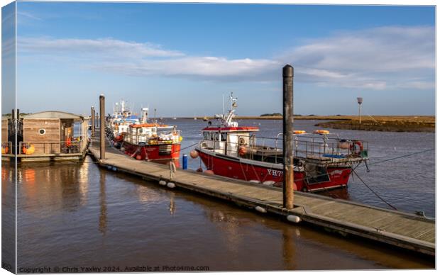 Fishing boats in Wells-next-the-sea harbour Canvas Print by Chris Yaxley