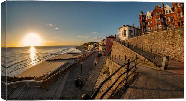 Sunrise over the sea in the coastal town of Cromer Canvas Print by Chris Yaxley