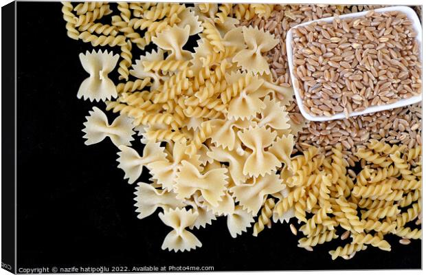 some dry wheat and different shapes of pasta standing on black background,close-up of macaroni and wheat together, Canvas Print by nazife hatipoğlu