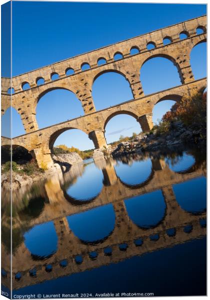 The Pont du Gard, vertical photography tilted over blue sky. Anc Canvas Print by Laurent Renault