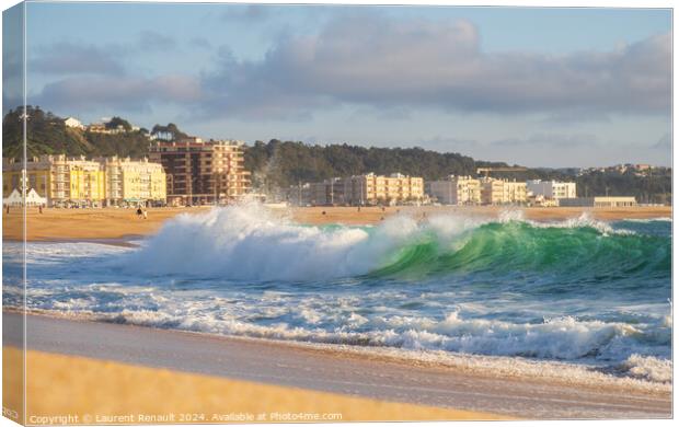 Big wave in Atlantic Ocean on the beach in Nazaré, Portugal Canvas Print by Laurent Renault