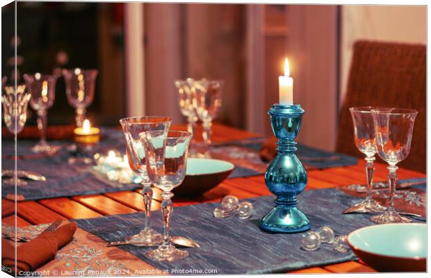 Dining table setting with glasses, decorations and candles Canvas Print by Laurent Renault